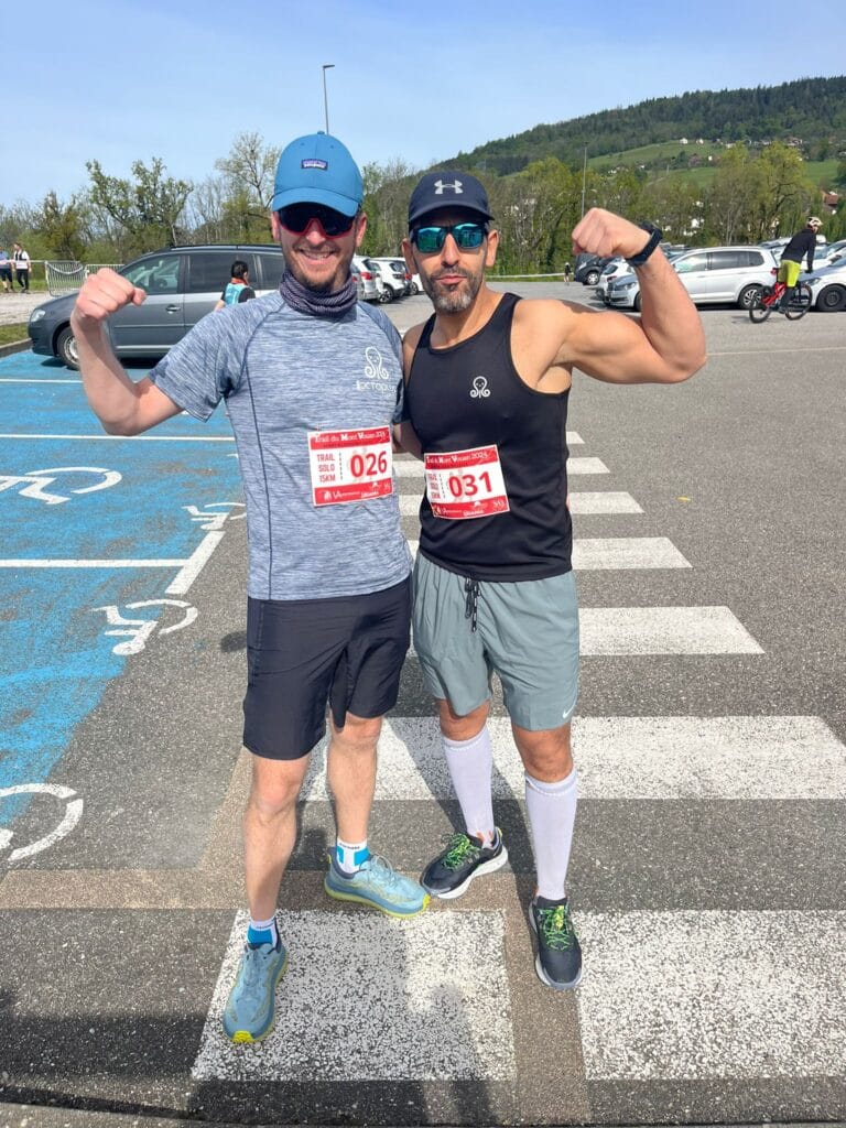Two riders pose after a race.