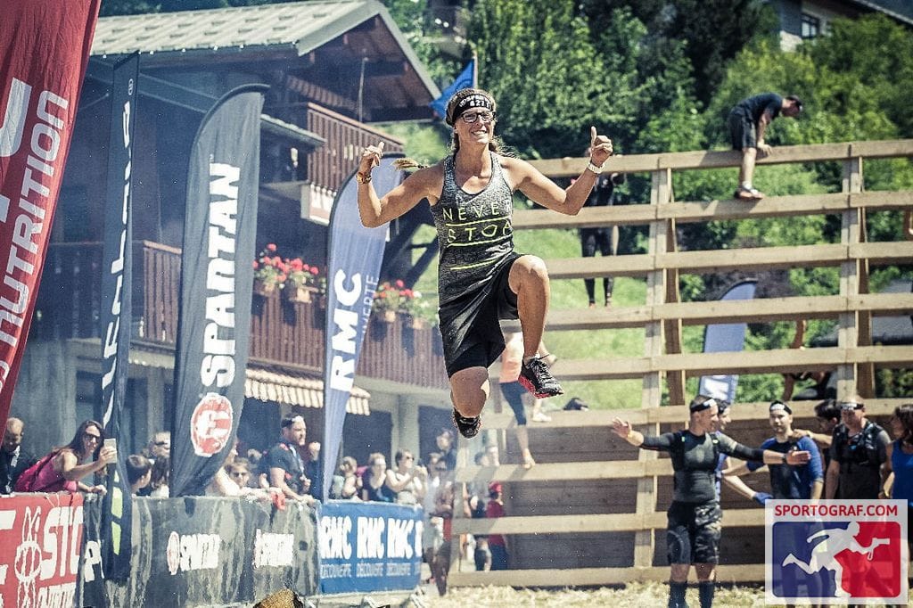 Runner jumping during a Spartan race.