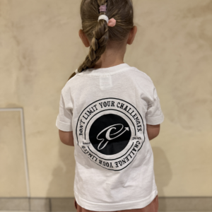Child with braid, motivational message t-shirt.